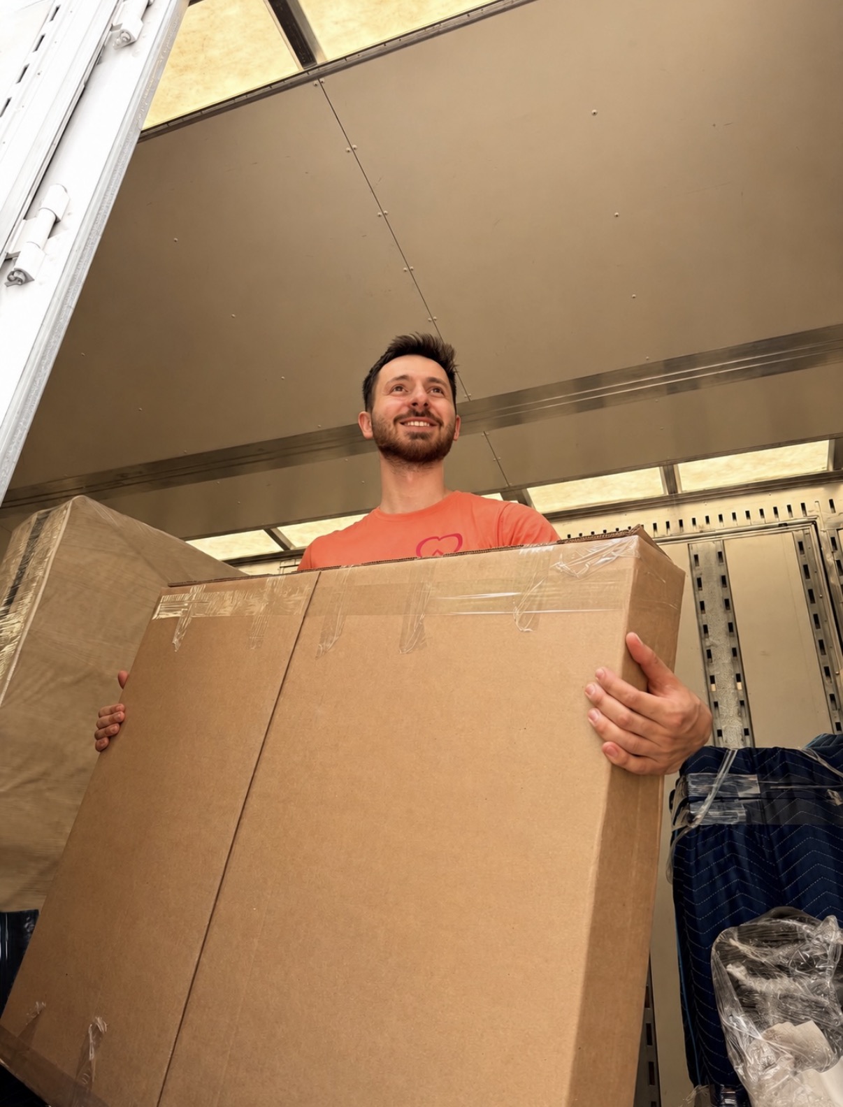 Movers preparing a protected item for transportation